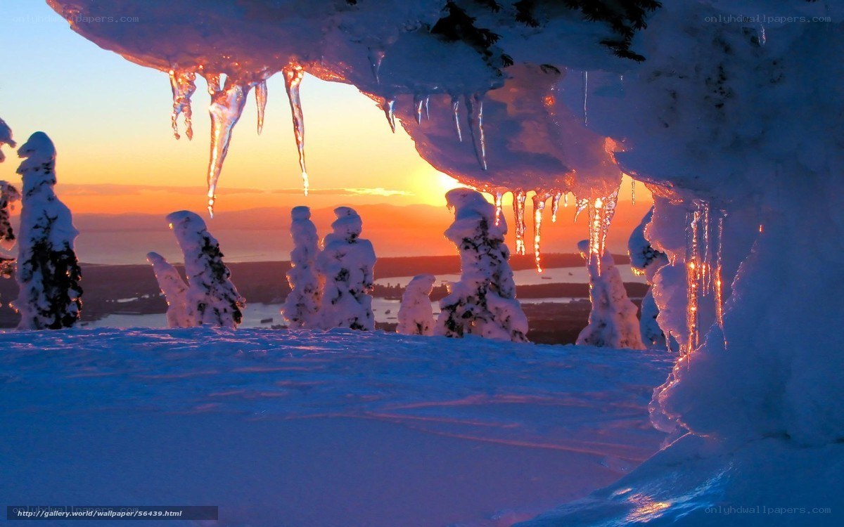 Icy cave at sunset