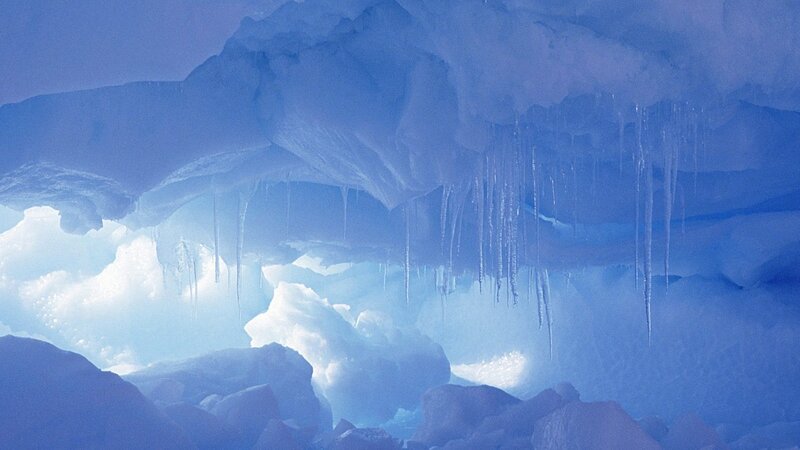 Icy cave with stalactites