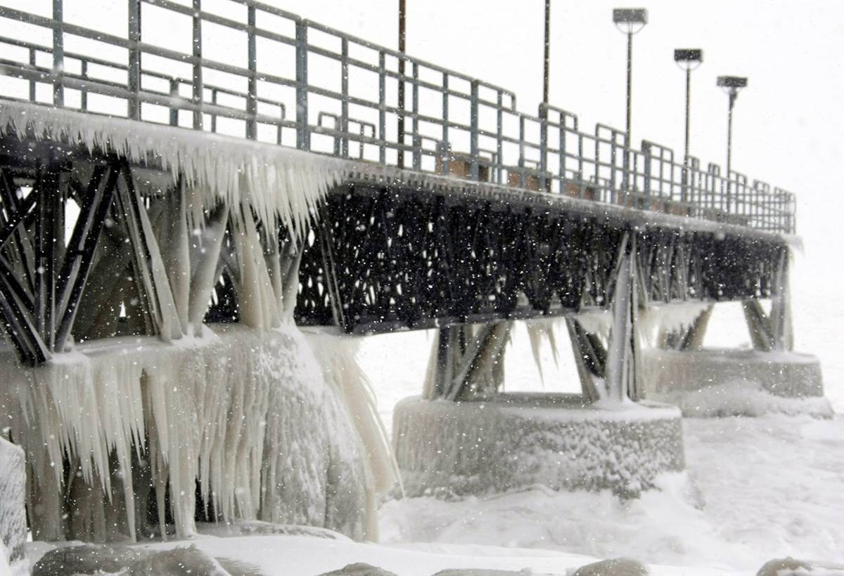 Icy pier during snowstorm