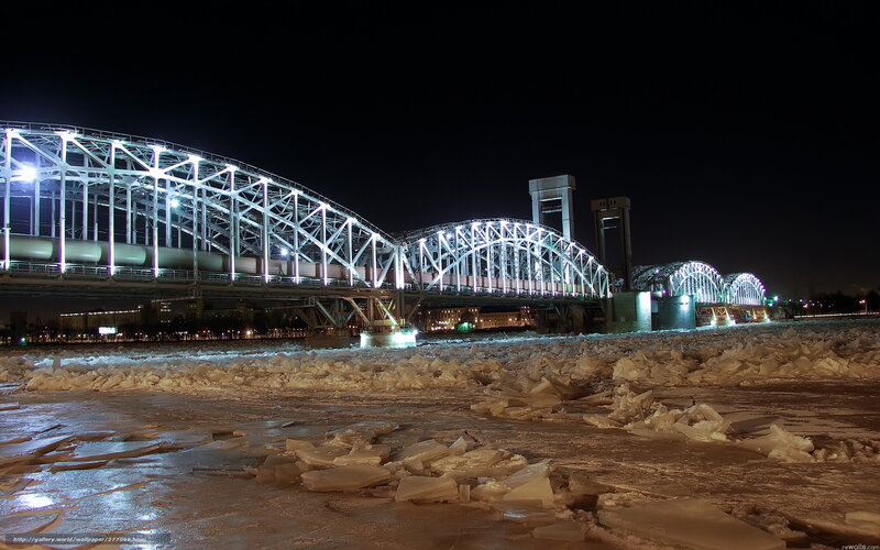 Icy river bridge at night