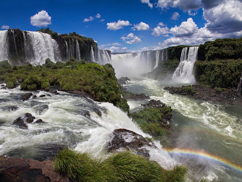 Iguazu Falls Waterfall — Blue, Dramatic, Afternoon, Photograph, Rainbow, River, Clouds, Vegetation