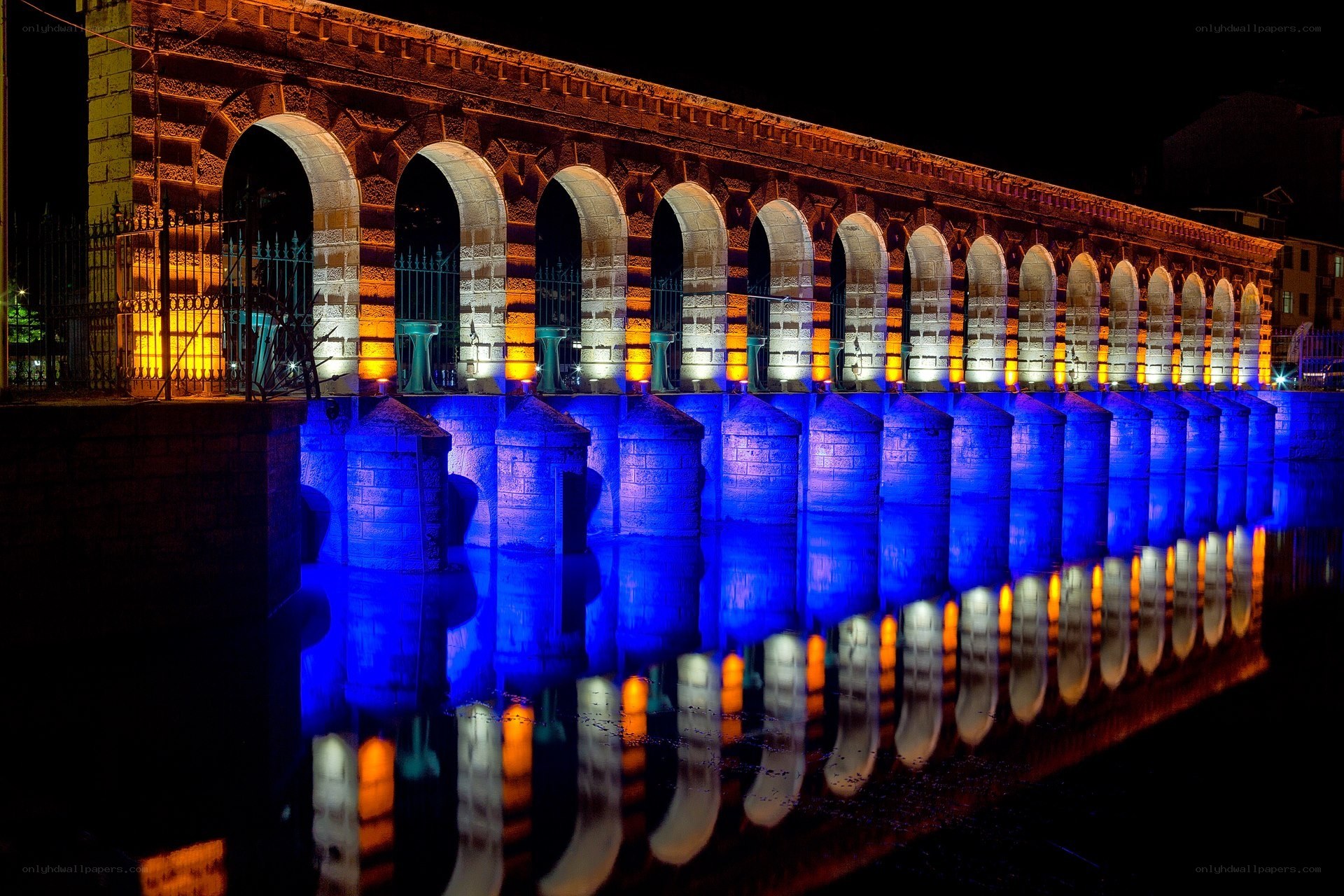 Illuminated aqueduct at night