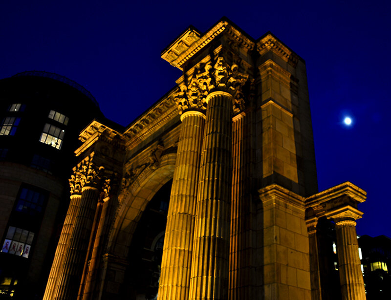 illuminated arch at night