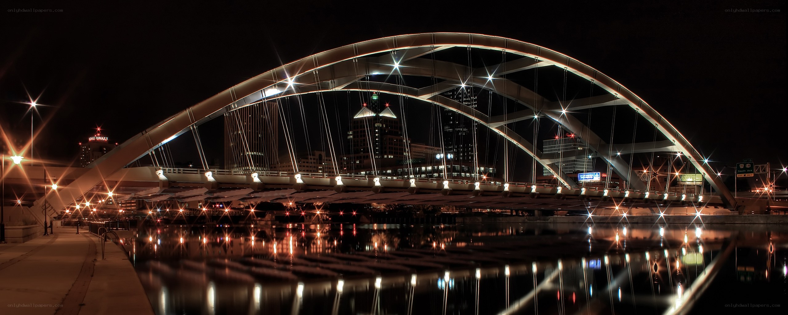 illuminated arch bridge at night