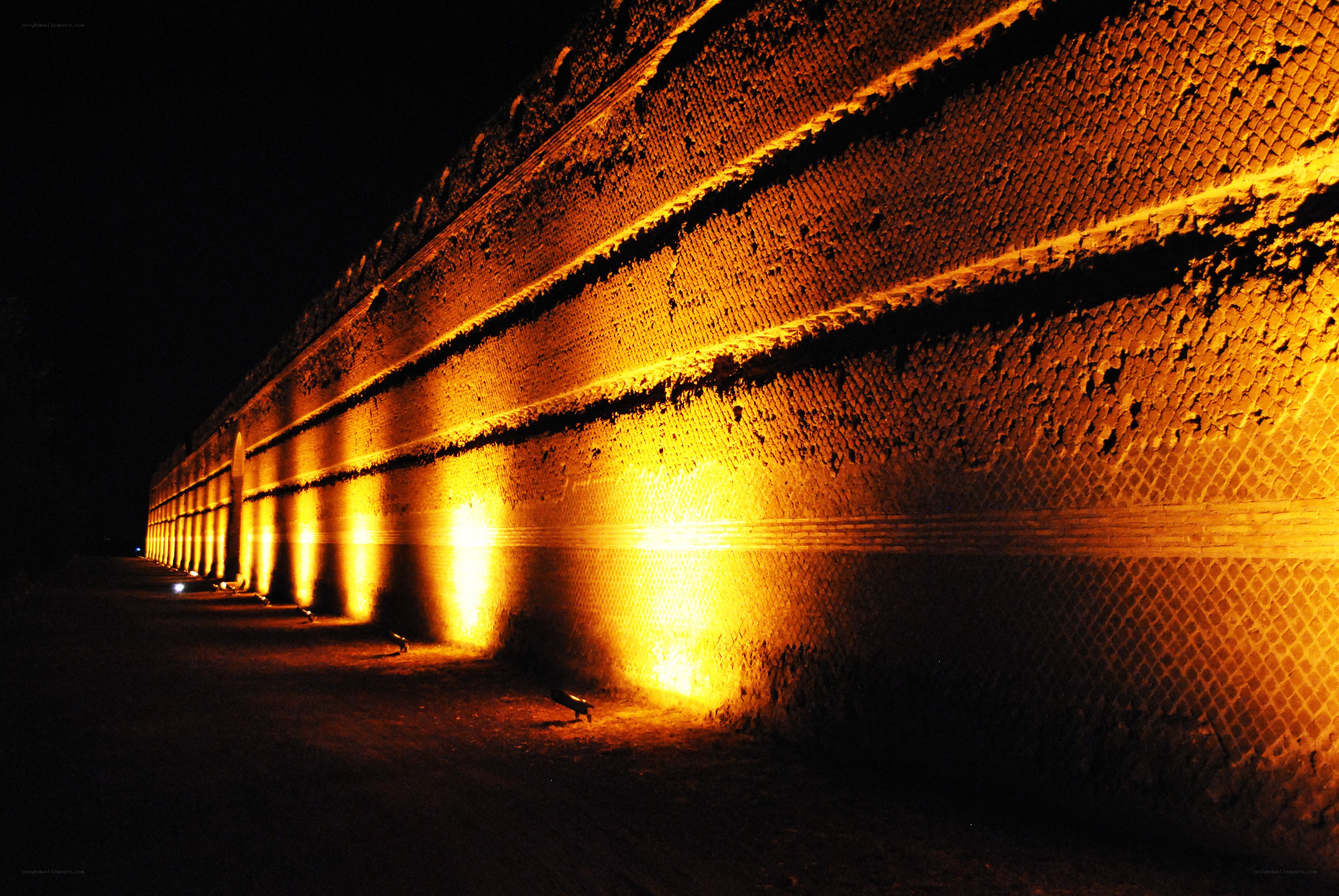 Illuminated brick wall at night