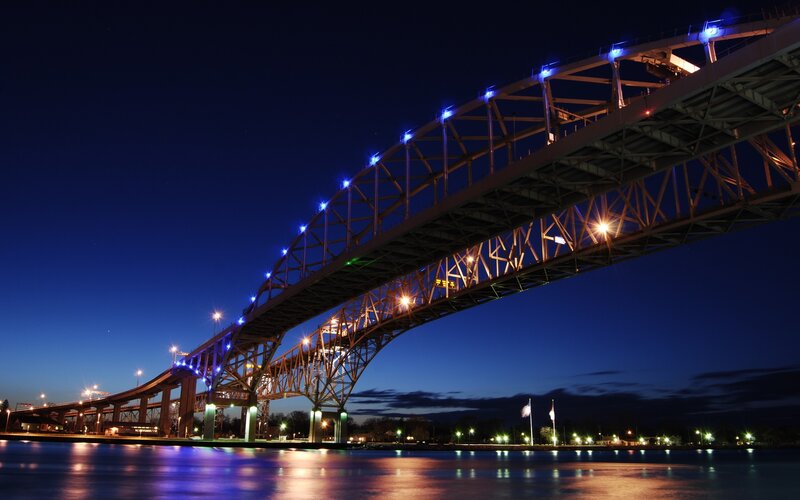 illuminated bridge at dusk