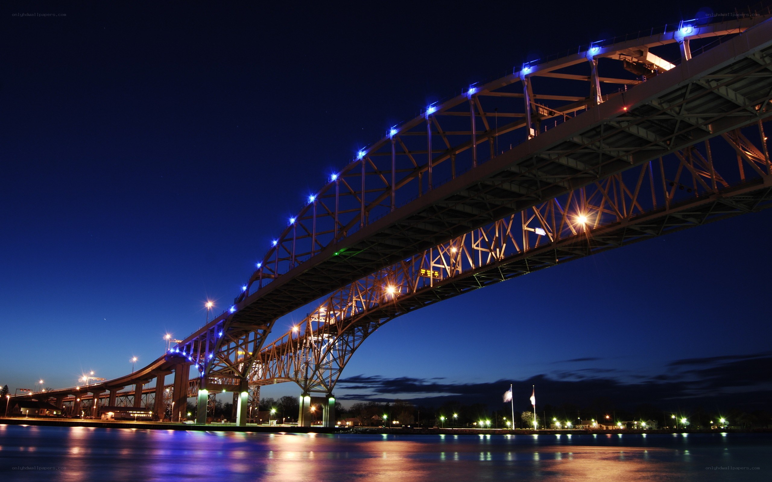 illuminated bridge at dusk