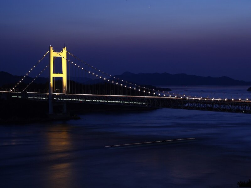 illuminated bridge at dusk