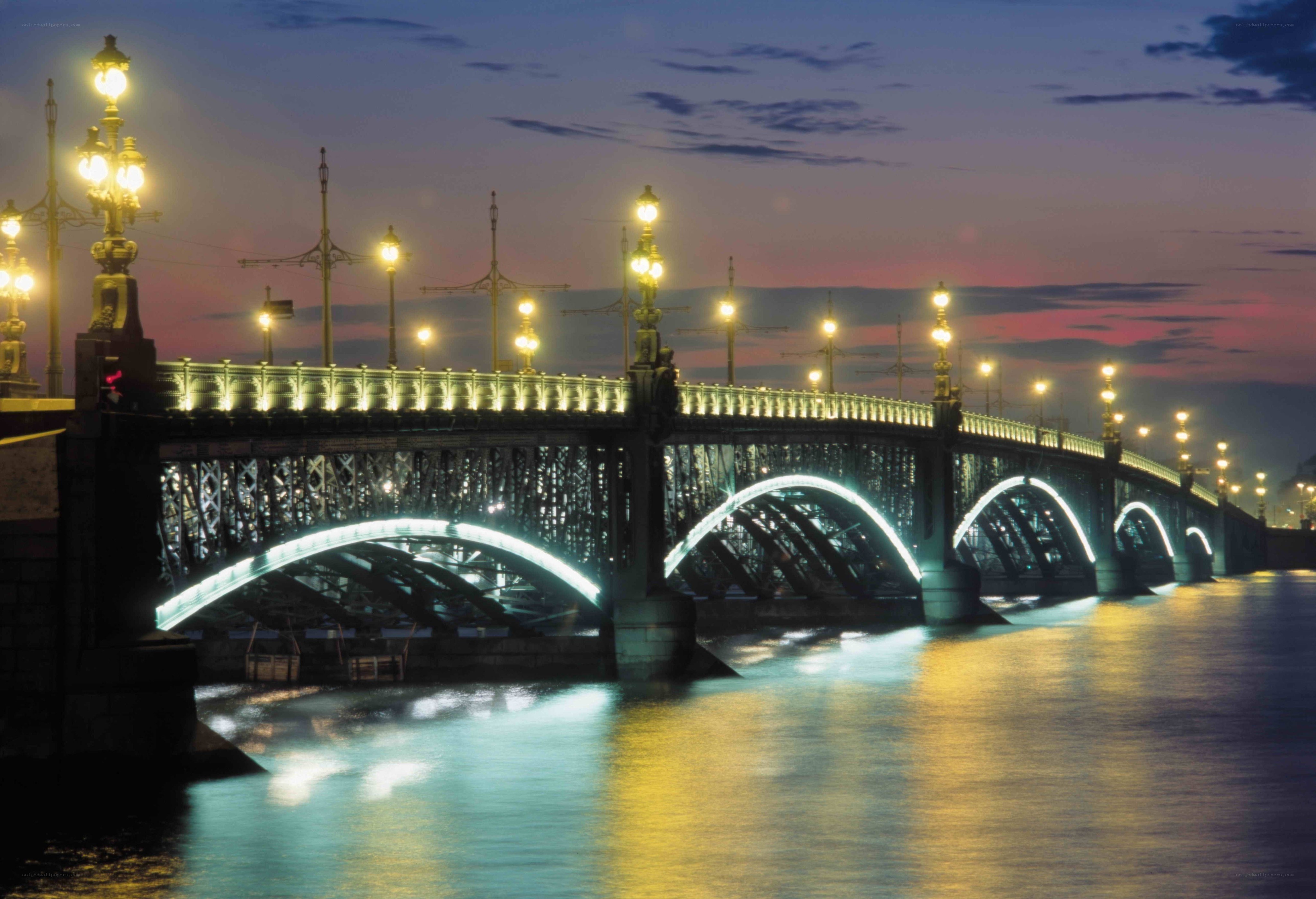 illuminated bridge at dusk