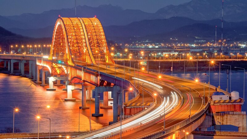 Illuminated bridge at dusk