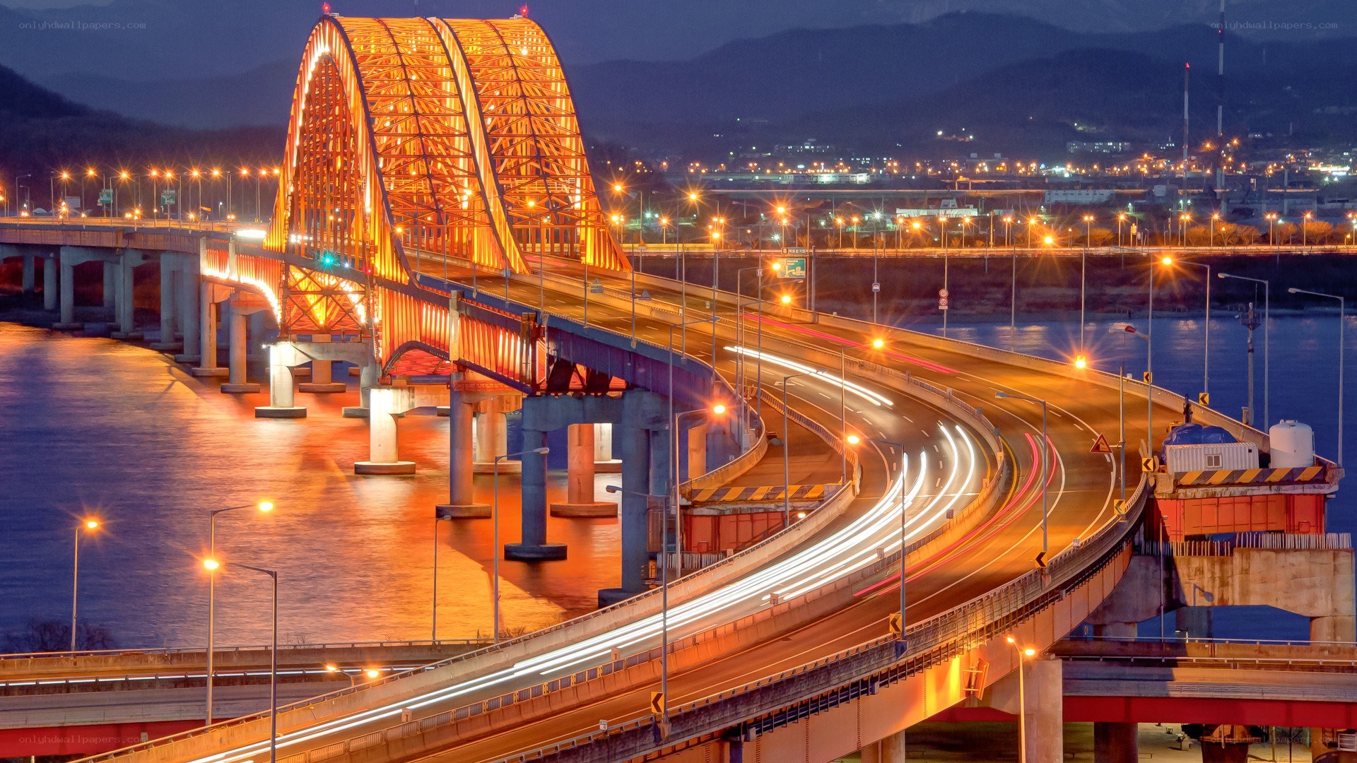 Illuminated bridge at dusk