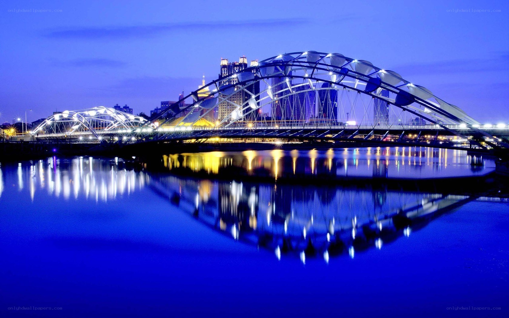 illuminated bridge at dusk