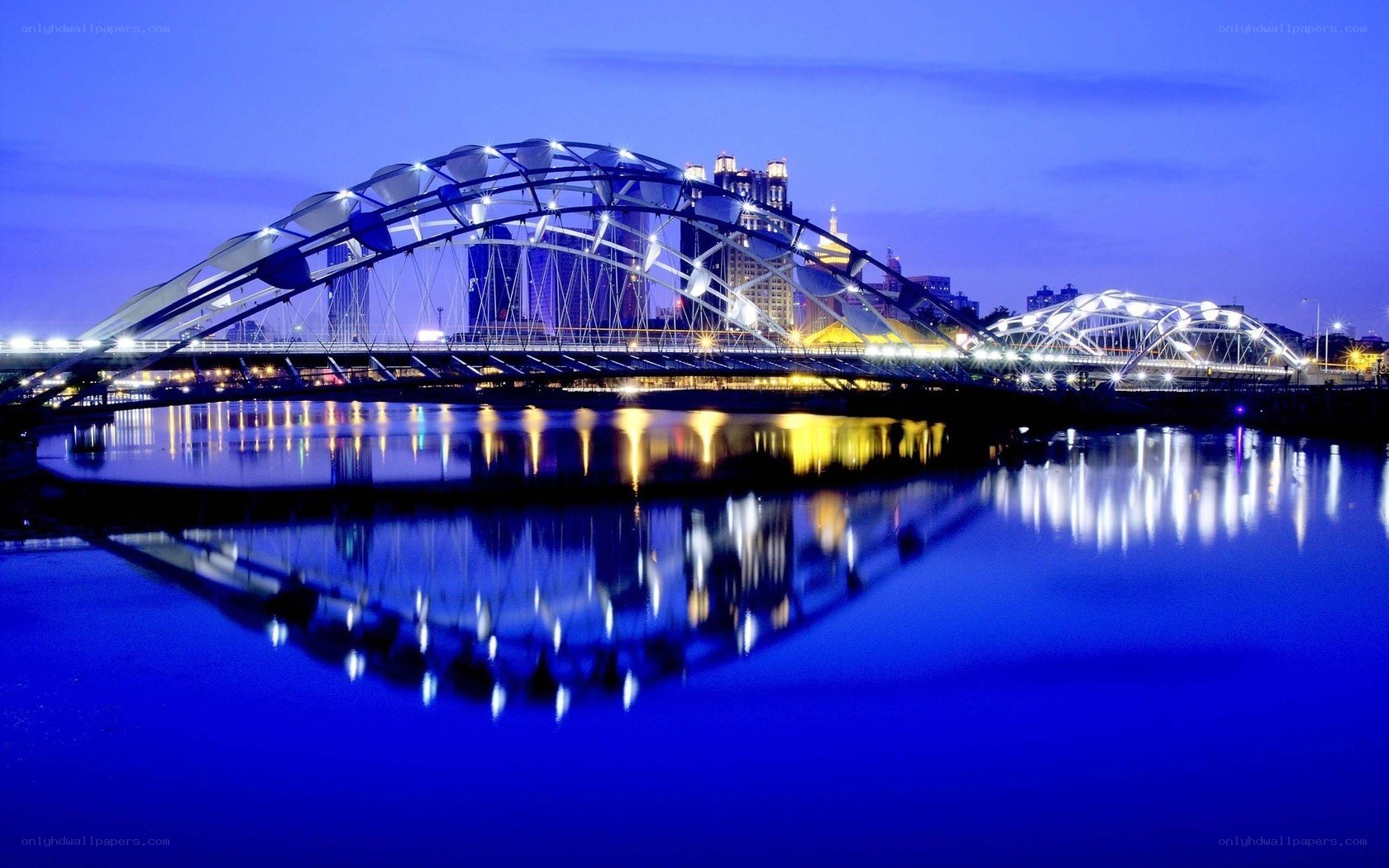 illuminated bridge at dusk