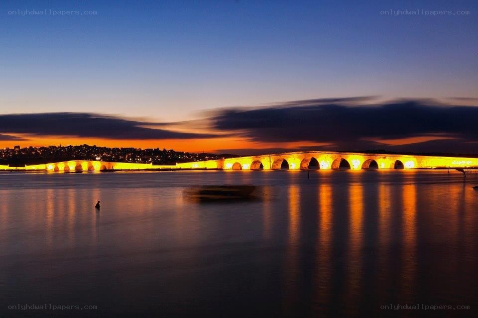 illuminated bridge at dusk