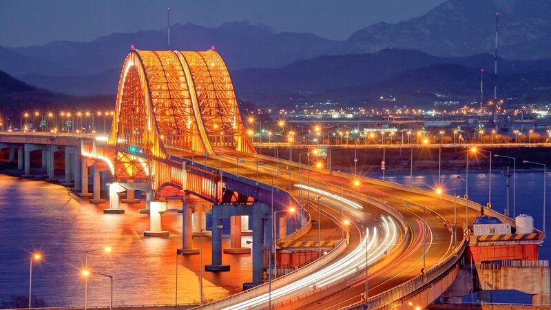 Illuminated bridge at dusk