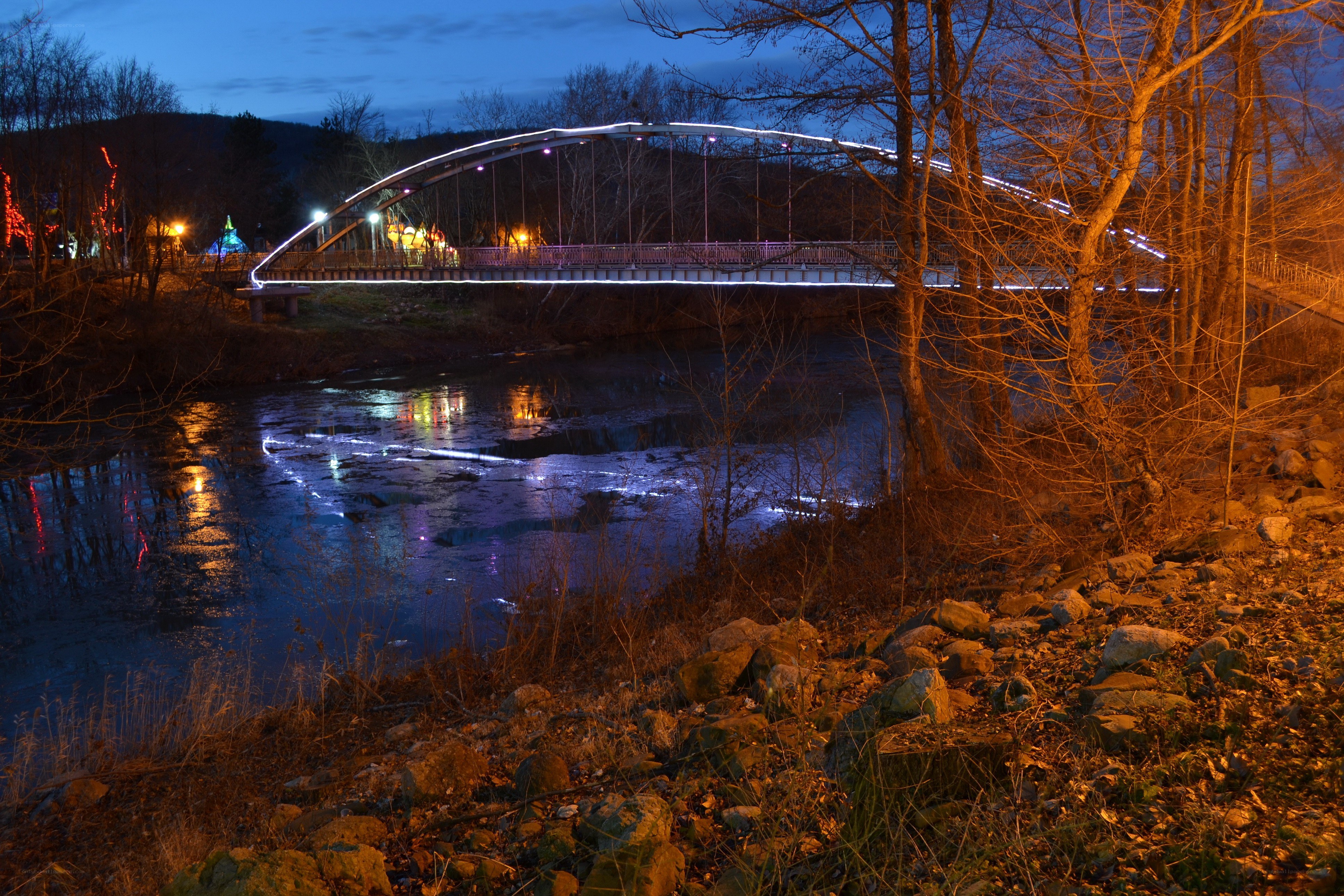 Illuminated bridge at dusk