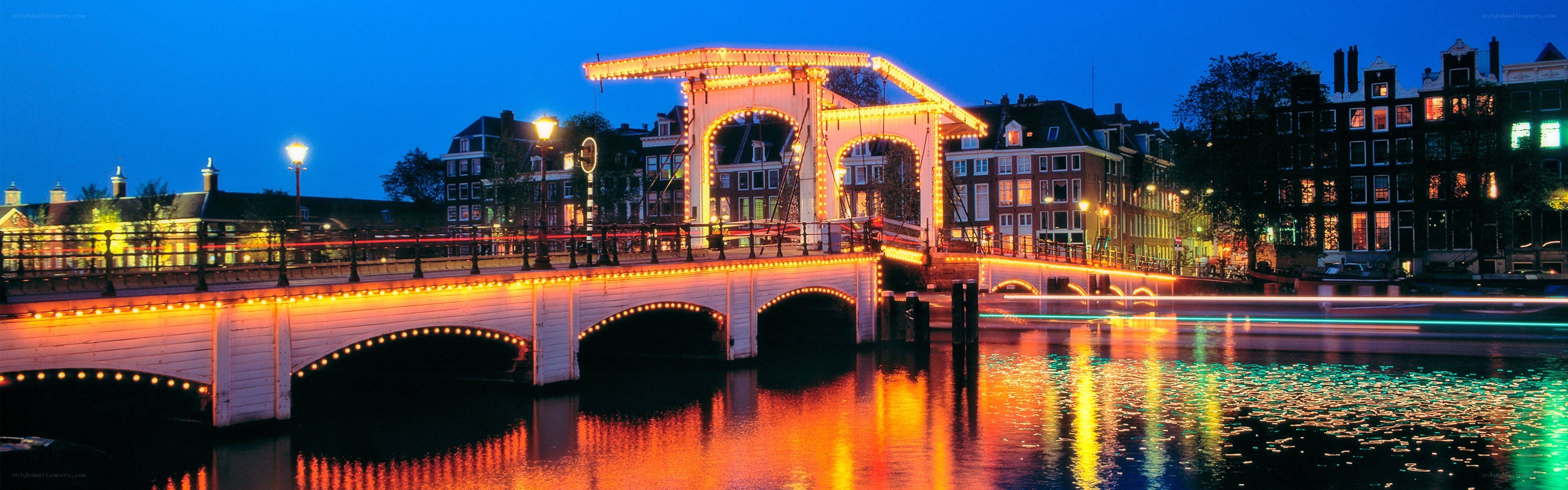 illuminated bridge at dusk