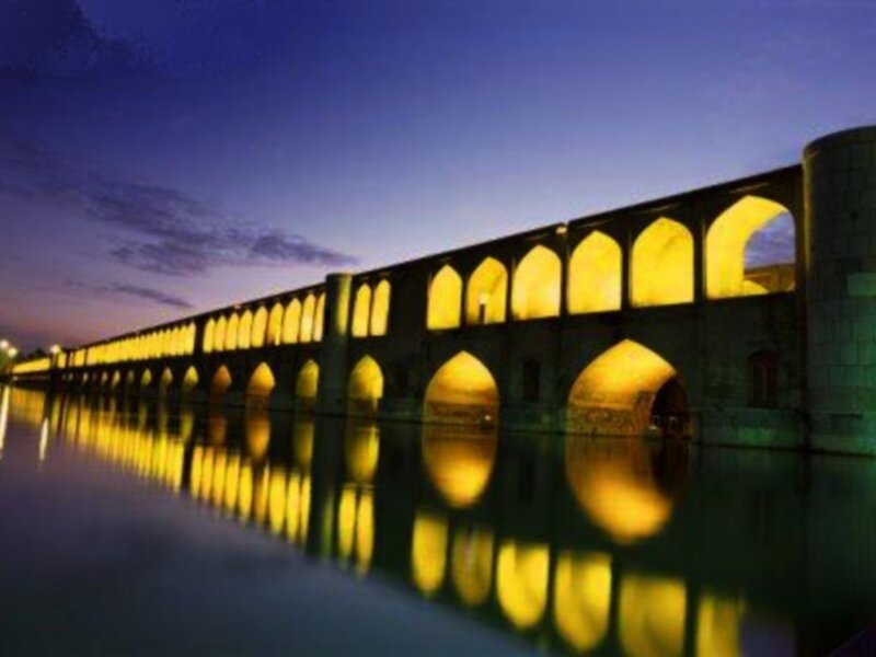 illuminated bridge at dusk