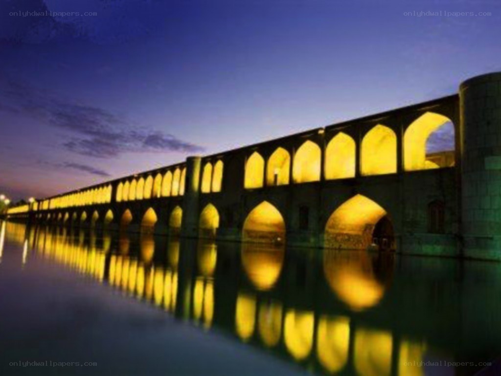 illuminated bridge at dusk