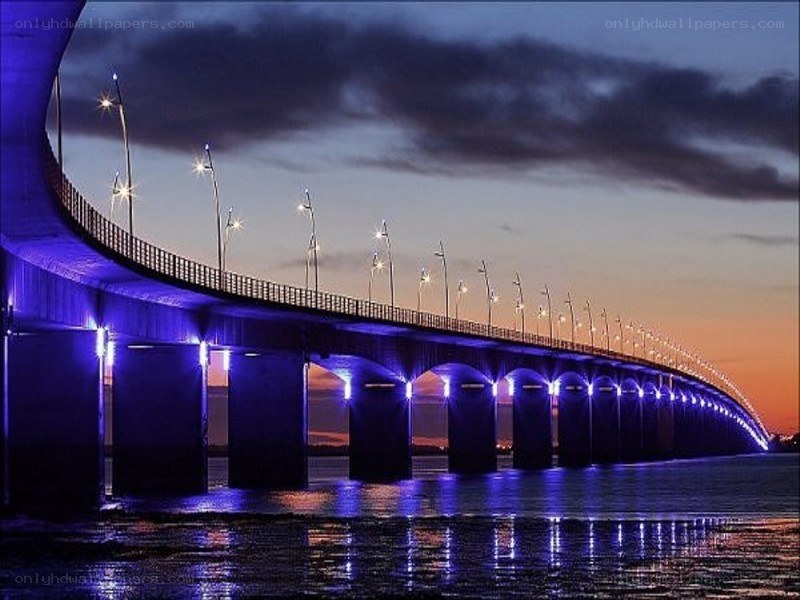 illuminated bridge at dusk