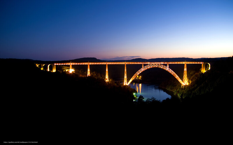 Illuminated bridge at dusk