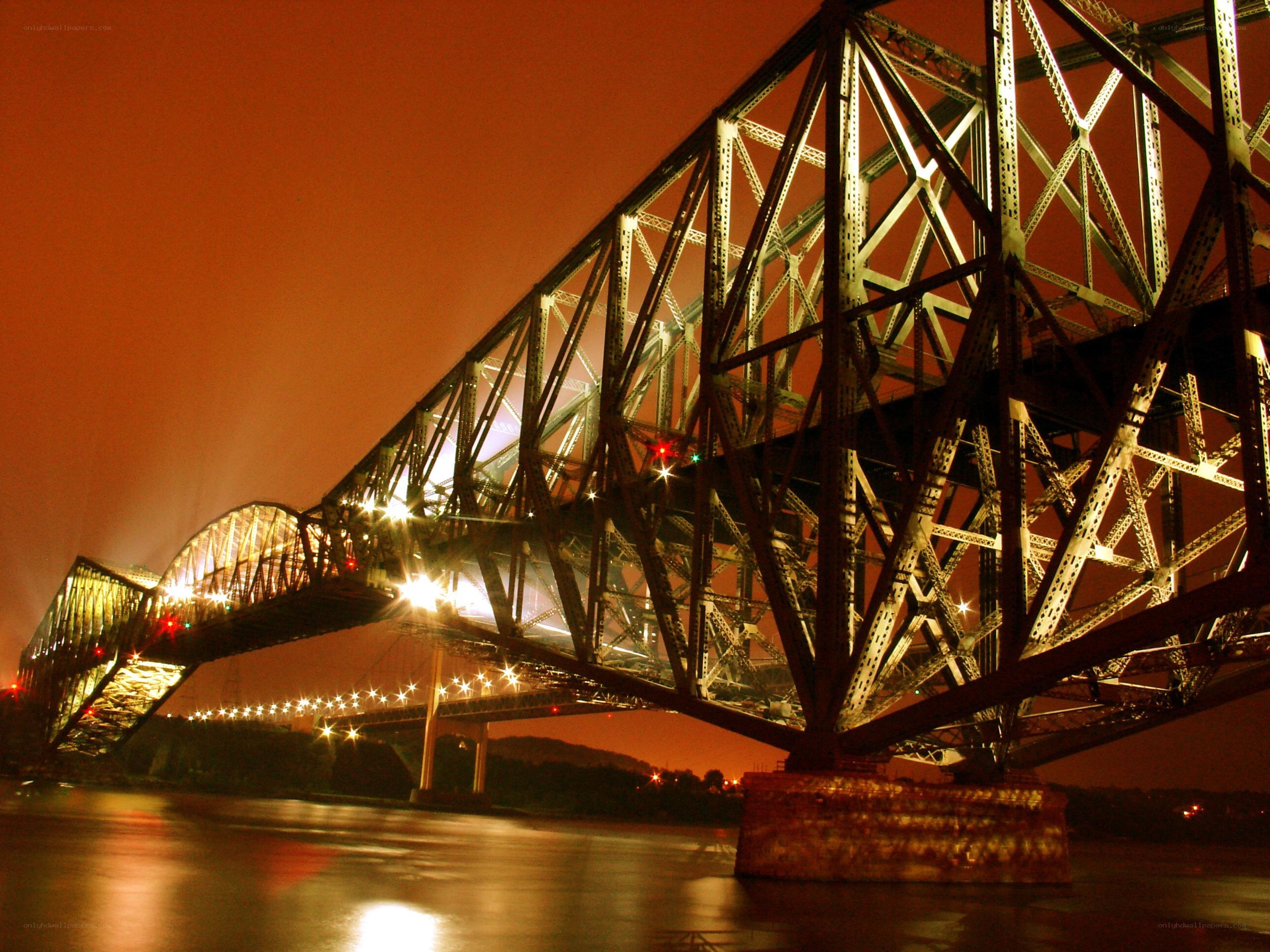 Illuminated bridge at night