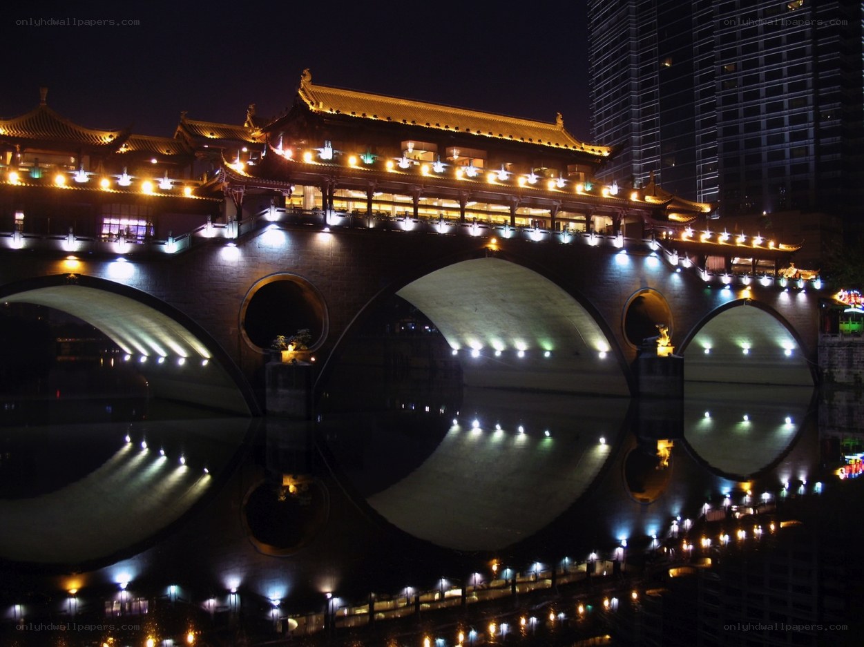 illuminated bridge at night