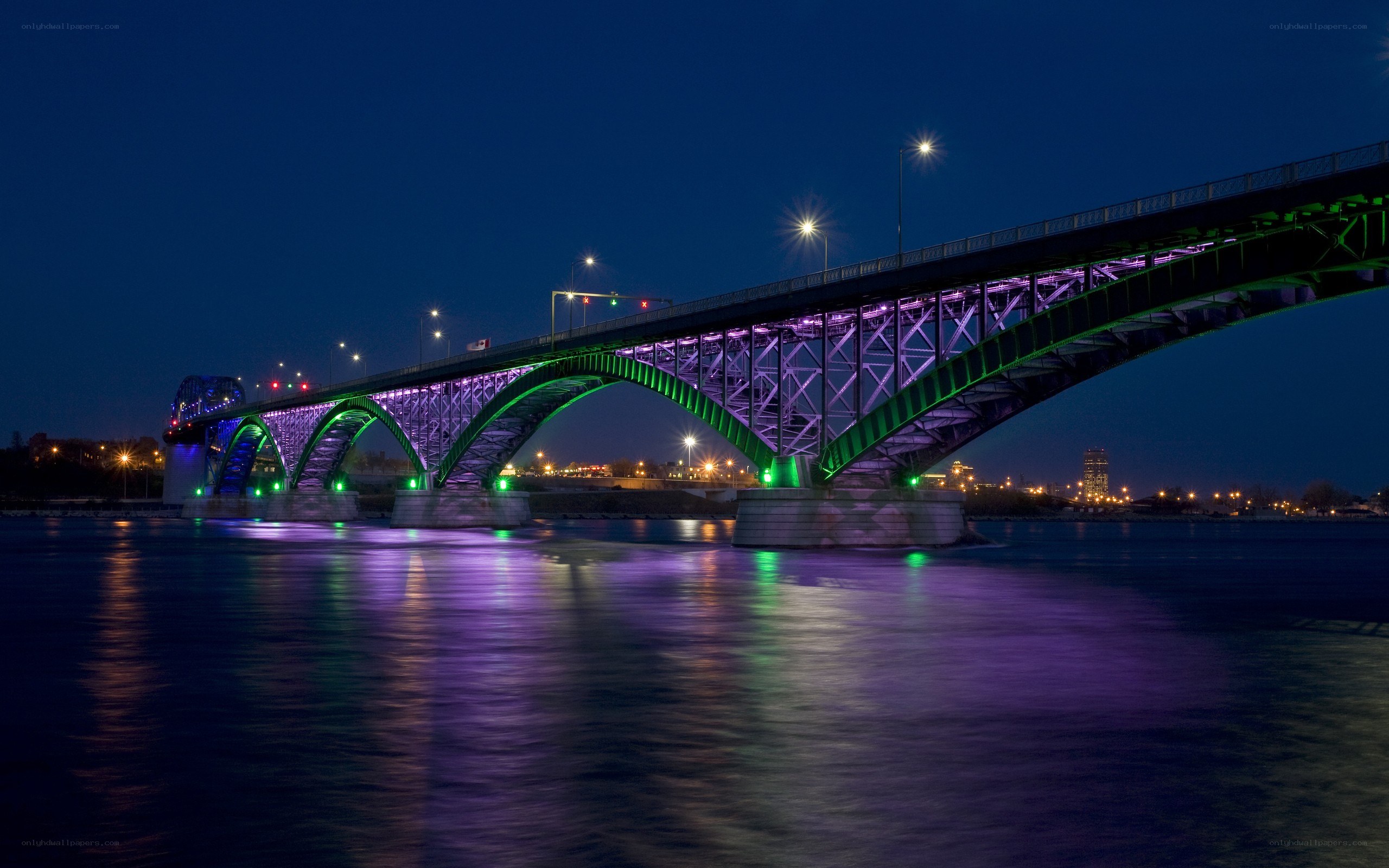illuminated bridge at night