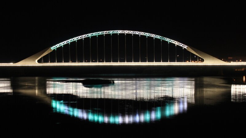 illuminated bridge at night