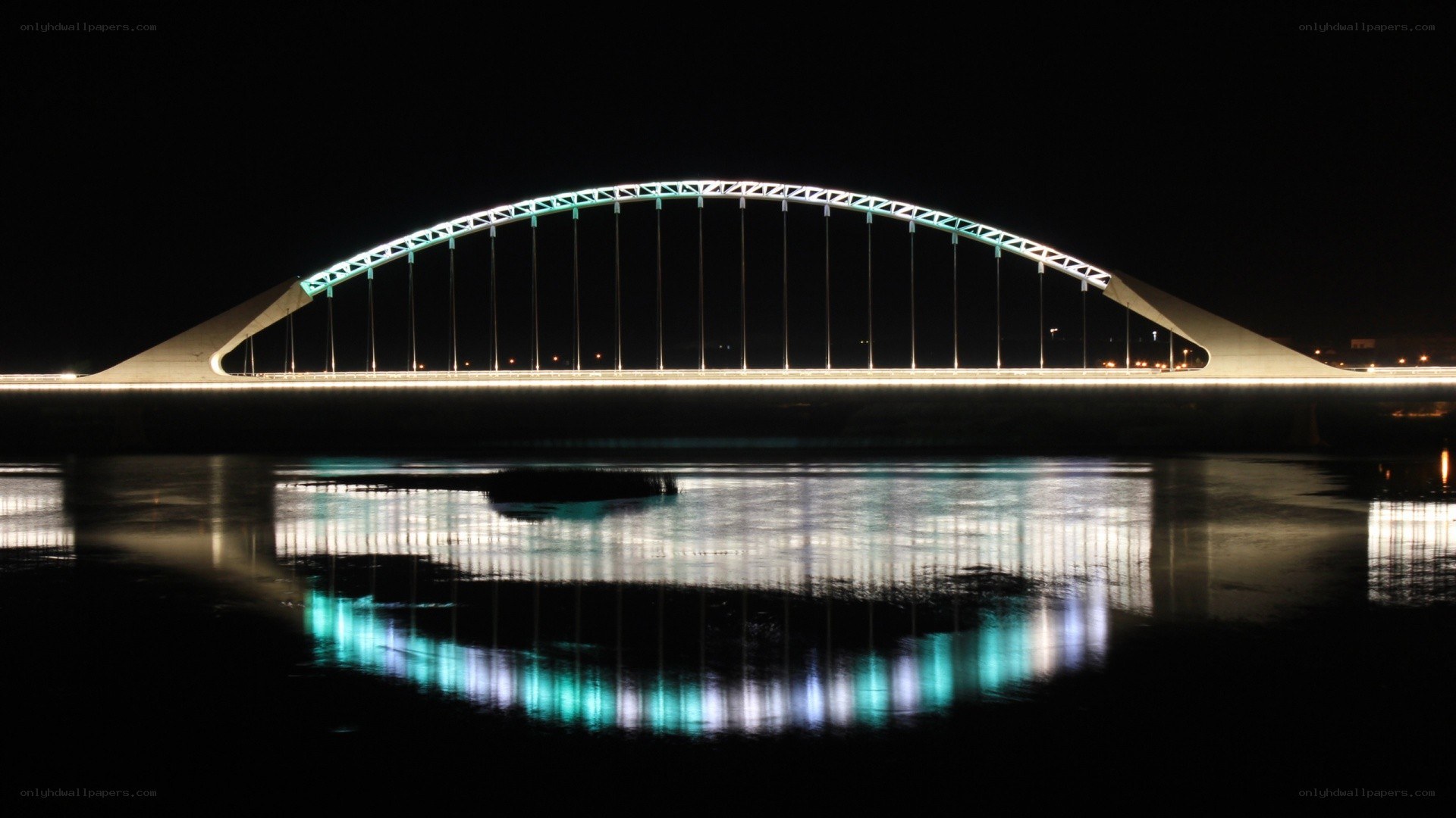 illuminated bridge at night