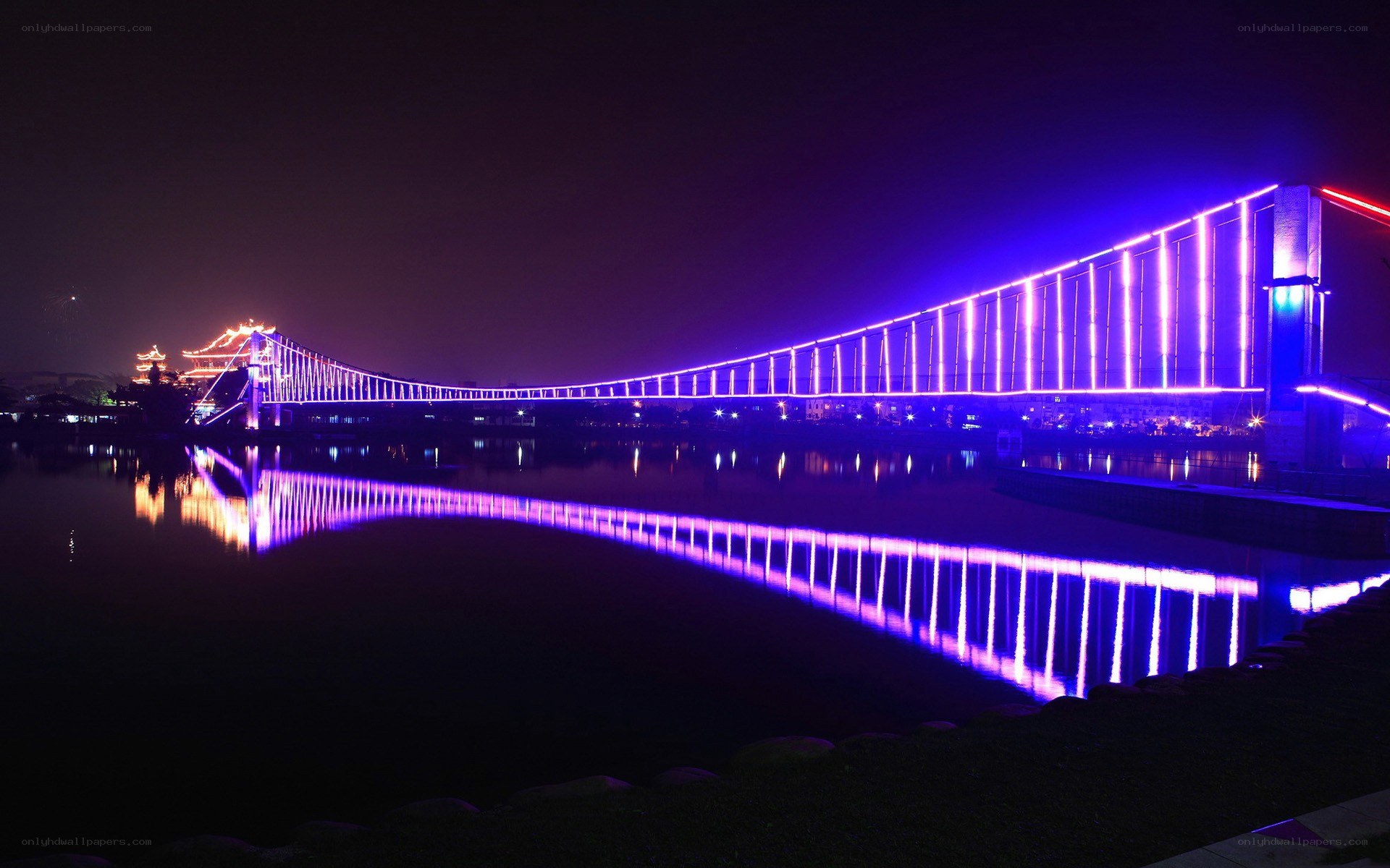 illuminated bridge at night