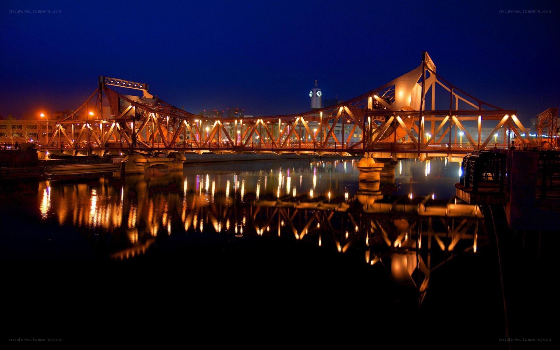 illuminated bridge at night