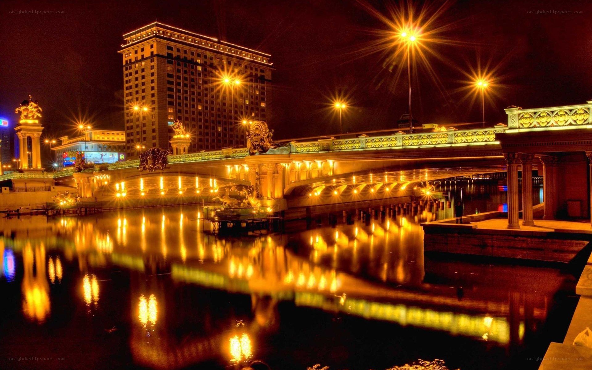 illuminated bridge at night