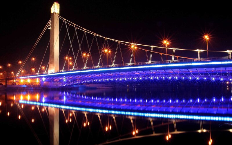 illuminated bridge at night