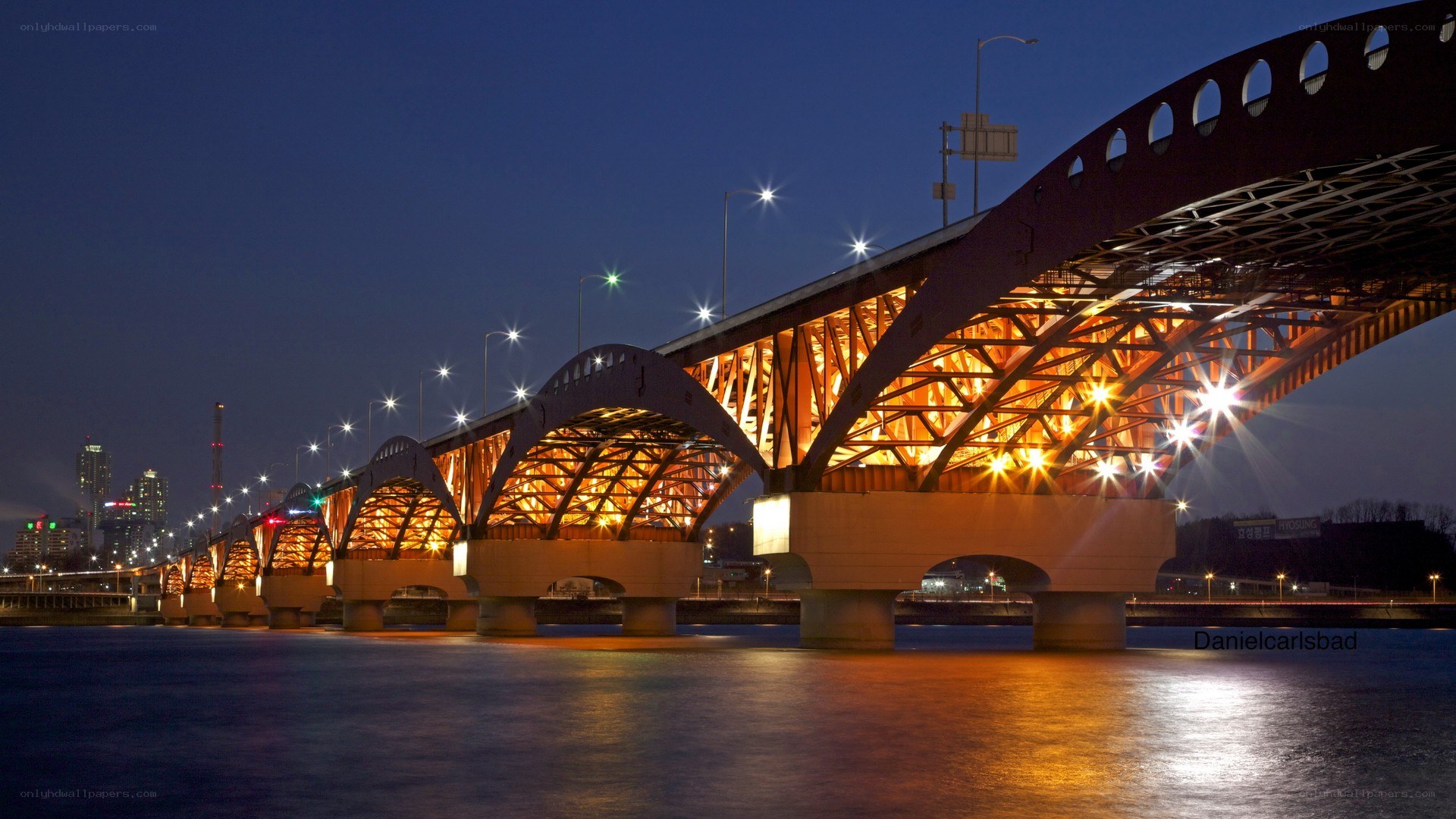 illuminated bridge at night