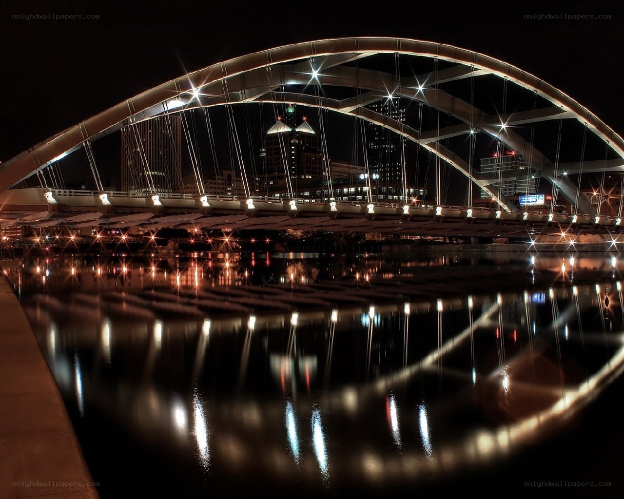 illuminated bridge at night