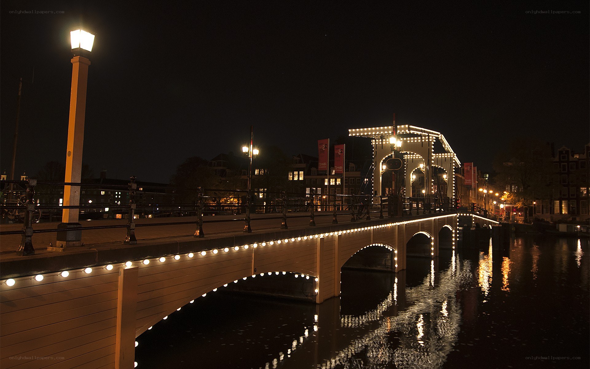 Illuminated bridge at night