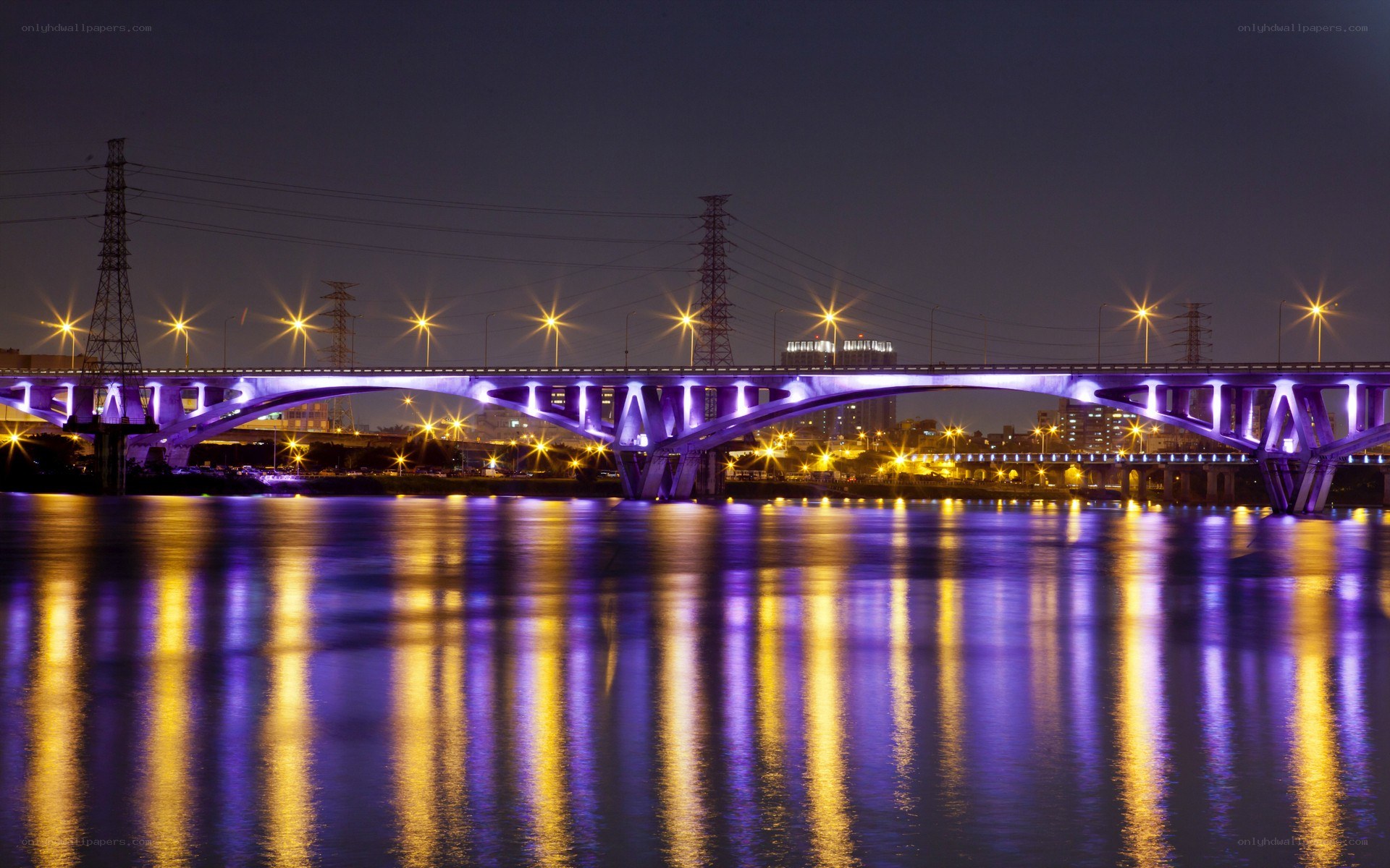 illuminated bridge at night