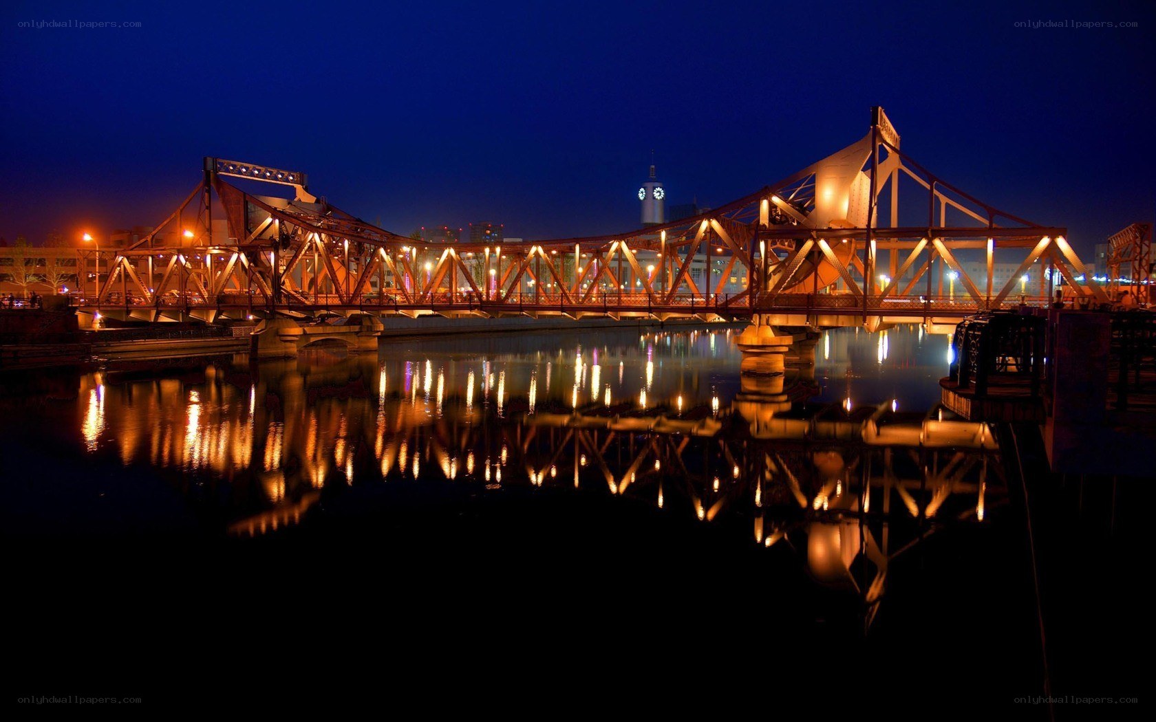 illuminated bridge at night