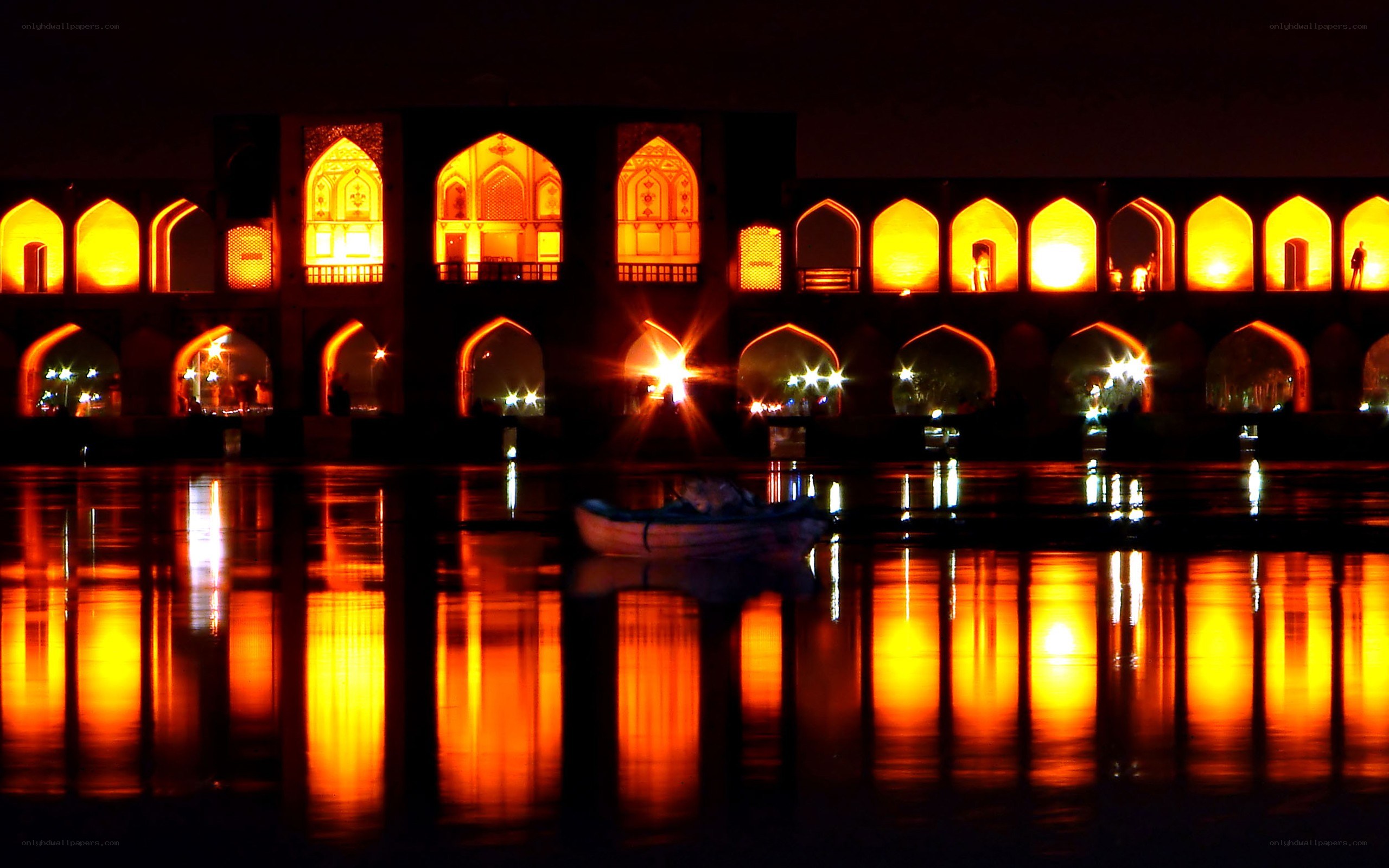 Illuminated bridge at night