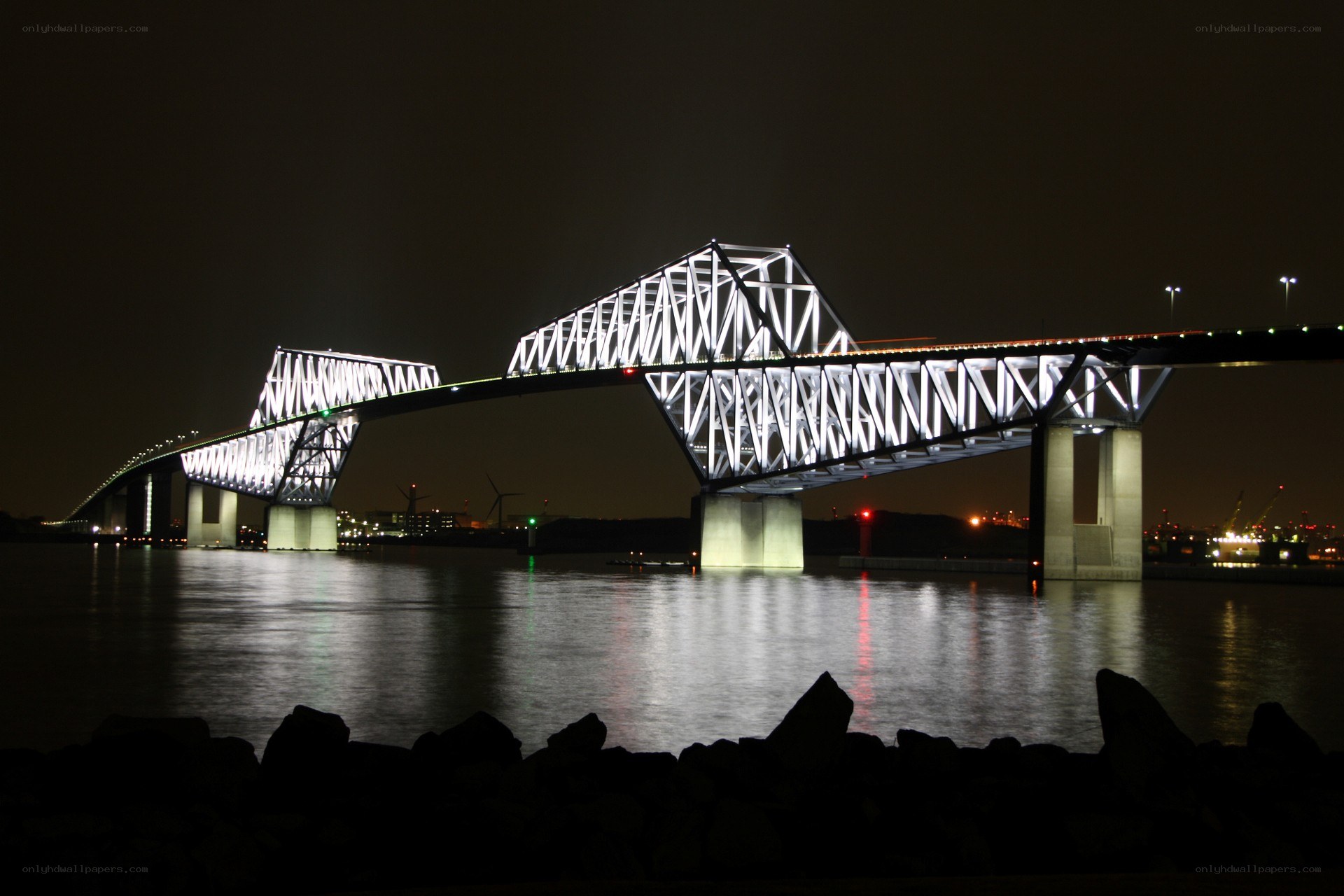 illuminated bridge at night