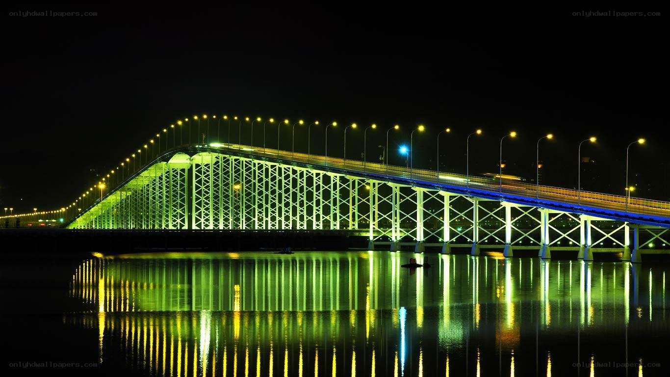 illuminated bridge at night