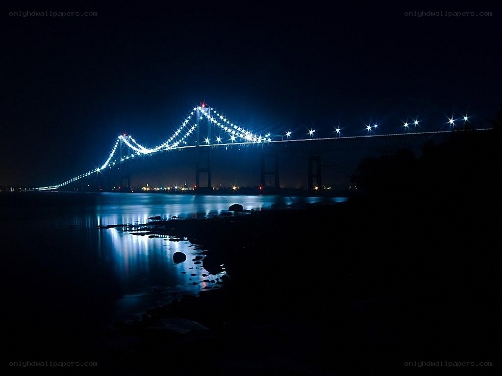 illuminated bridge at night