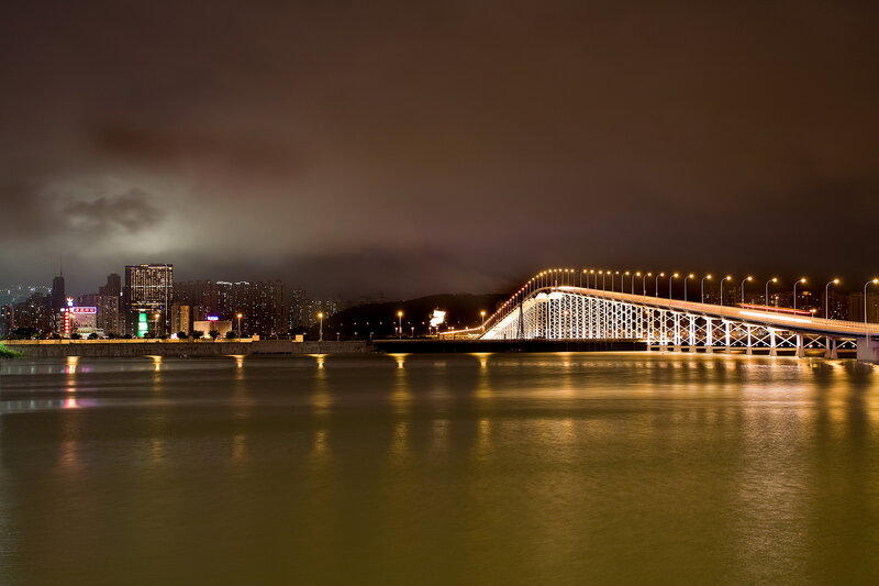 Illuminated Bridge at Night — Black, Dramatic, Photograph, City Skyline