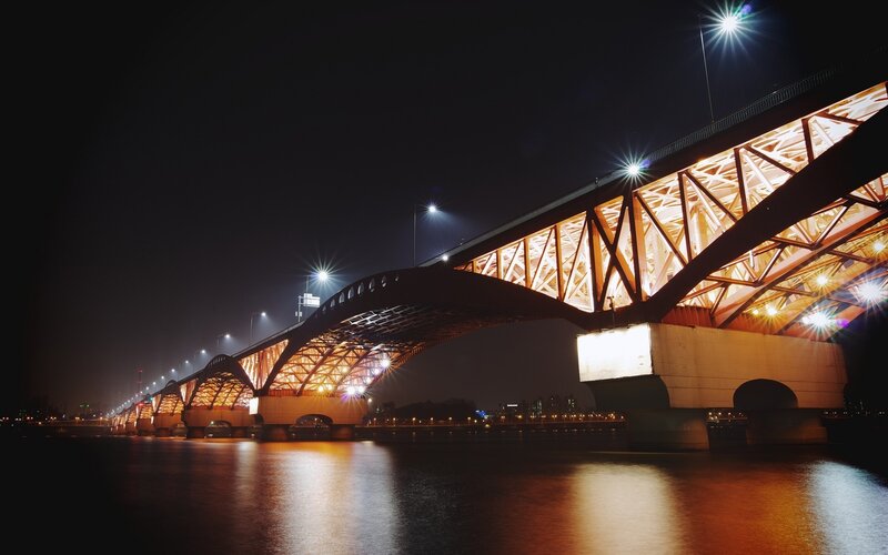 Illuminated Bridge at Night — Black, Dramatic, Photograph, River