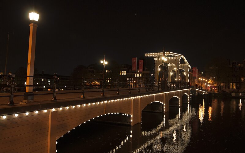 Illuminated Bridge at Night — Black, Serene, Photograph, Canal, Buildings