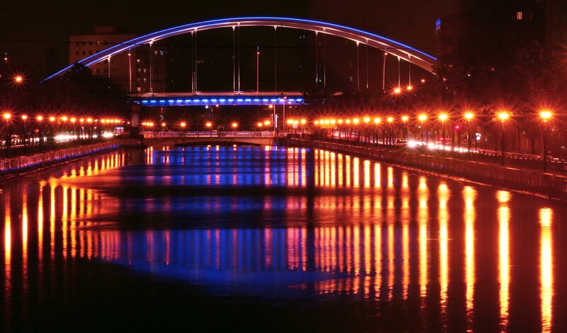 Illuminated Bridge at Night — Blue, Calm, Photograph, River, Streetlights