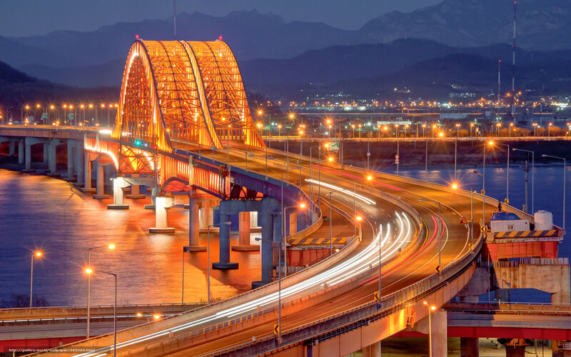 Illuminated Bridge at Night — Orange, Dramatic, Photograph, Mountains