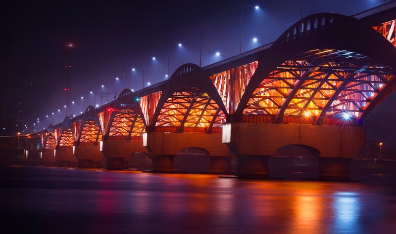 Illuminated Bridge at Night — Orange, Dramatic, Photograph, River