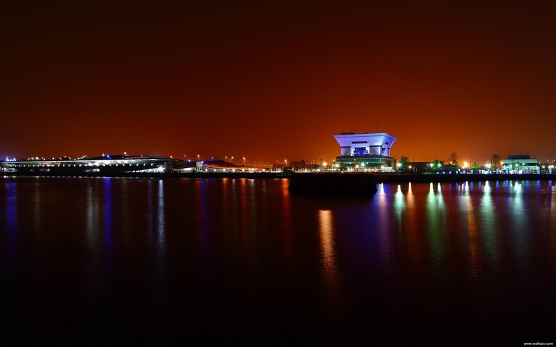 Illuminated Building at Night — Orange